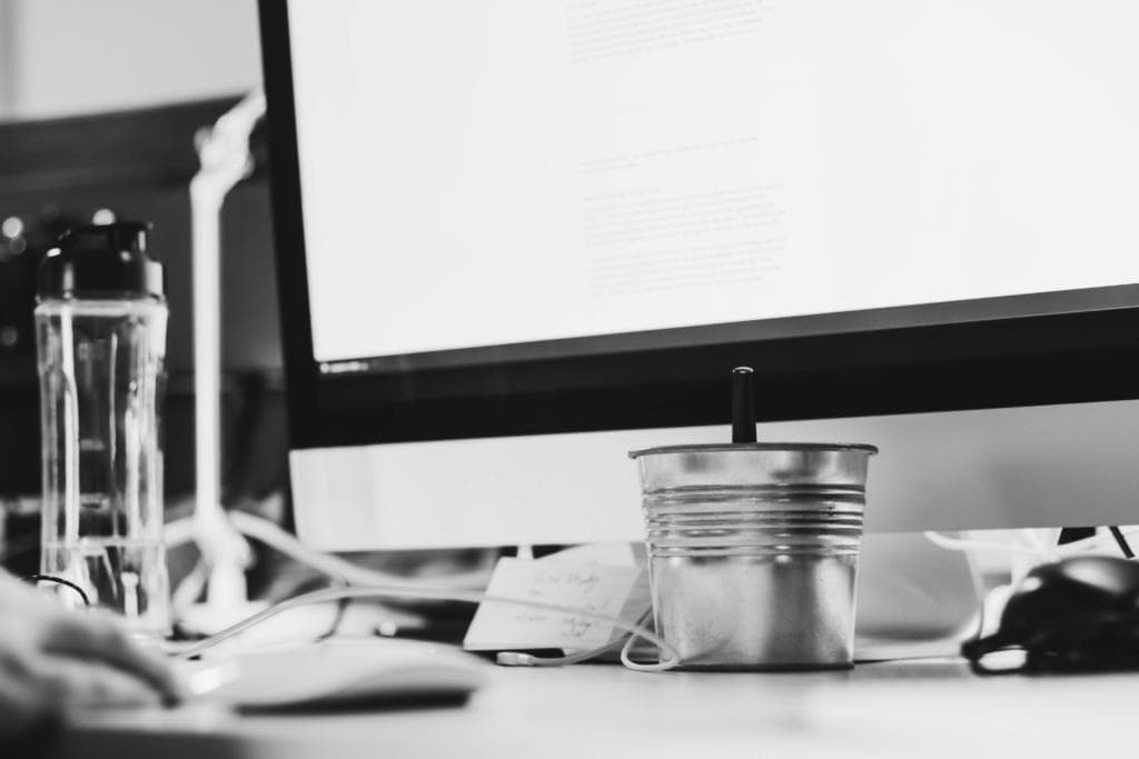 Desk with Computer Showing A Page With A Low Bounce Rate