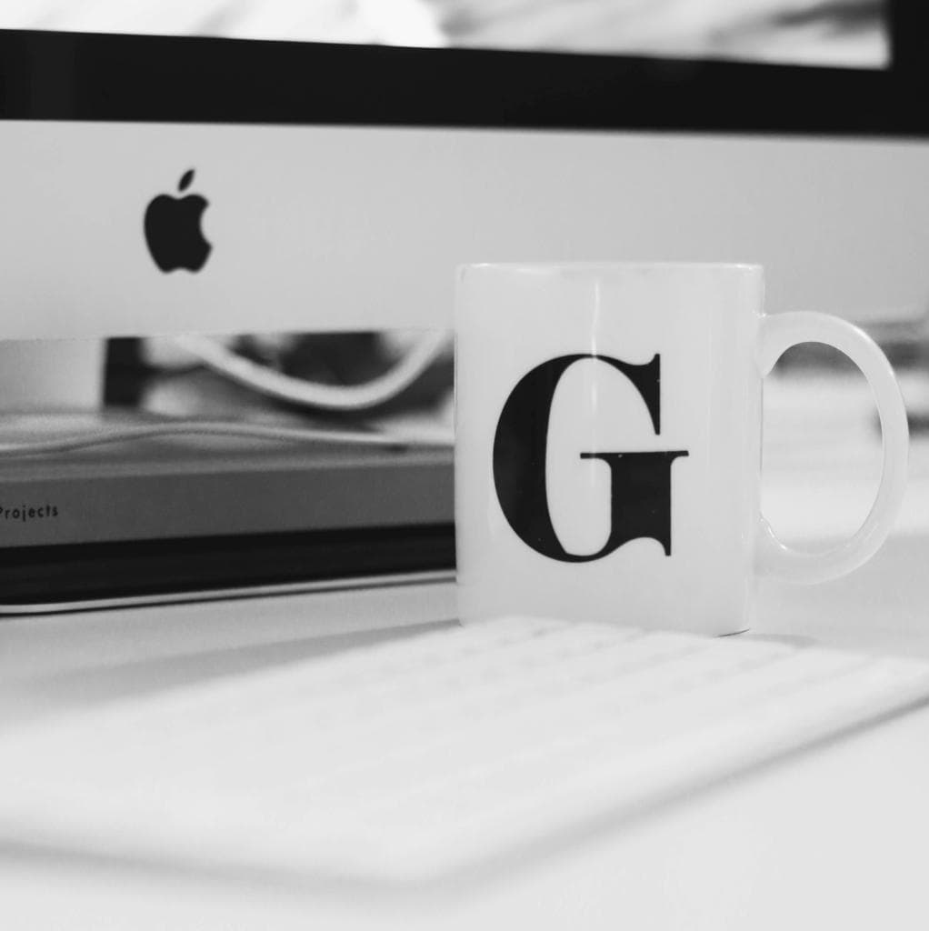 Mug on table in front of computer