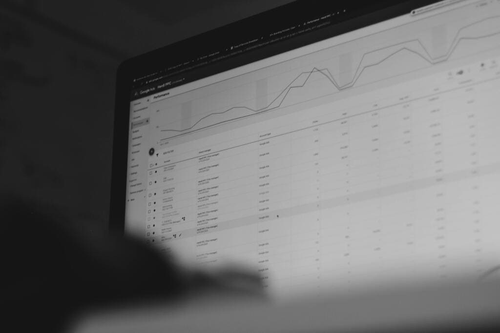 Black and white photo of a Google Analytics-style dashboard showing fluctuating performance graphs after a Google core update.
